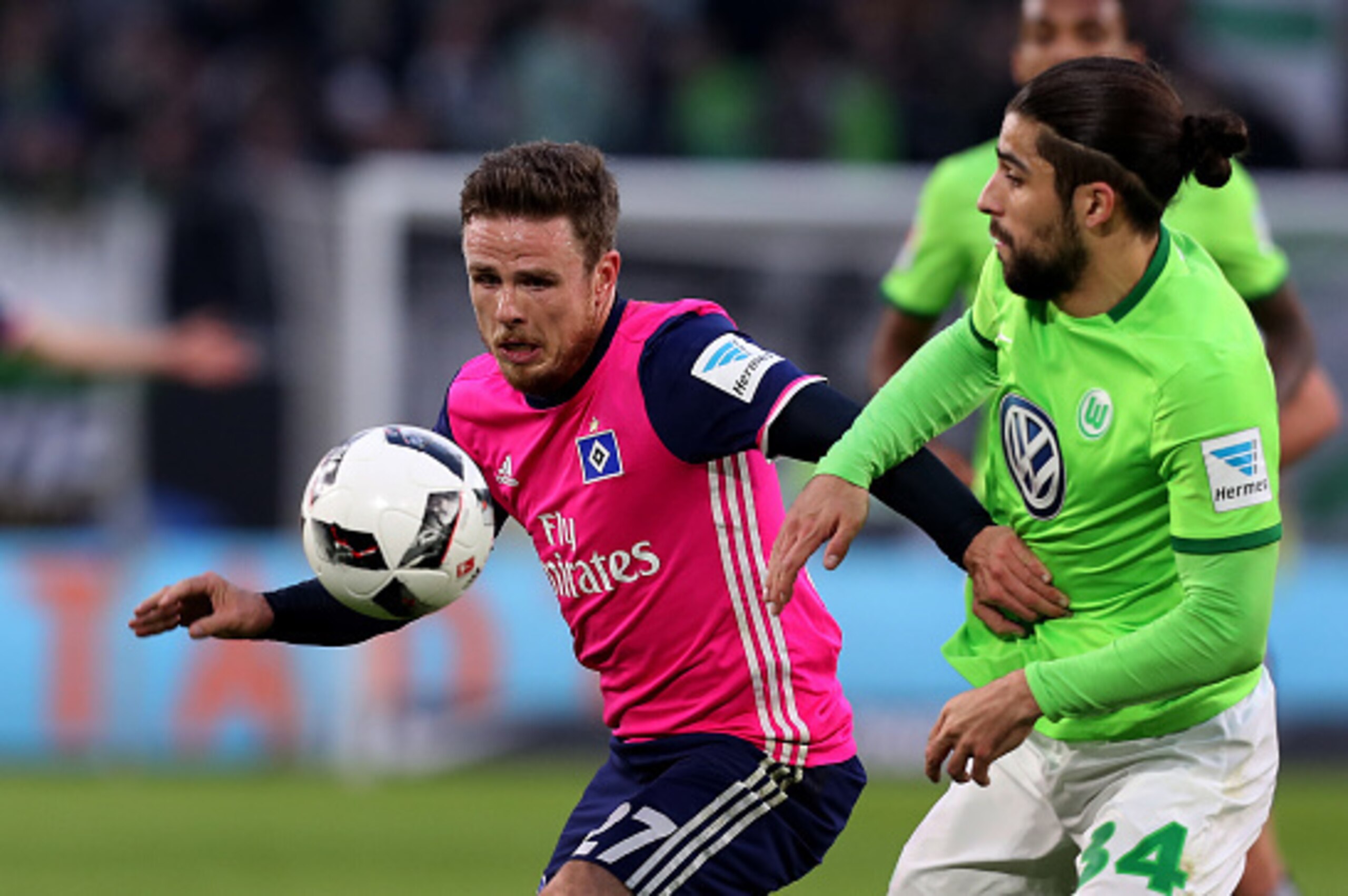 WOLFSBURG, GERMANY - JANUARY 21: Nicolai Mueller (L) of Hamburg and Ricardo Rodriguez (R) of Wolfsburg vie during the Bundesliga match between VfL Wolfsburg and Hamburger SV at Volkswagen Arena on January 21, 2017 in Wolfsburg, Germany. (Photo by Ronny Ha