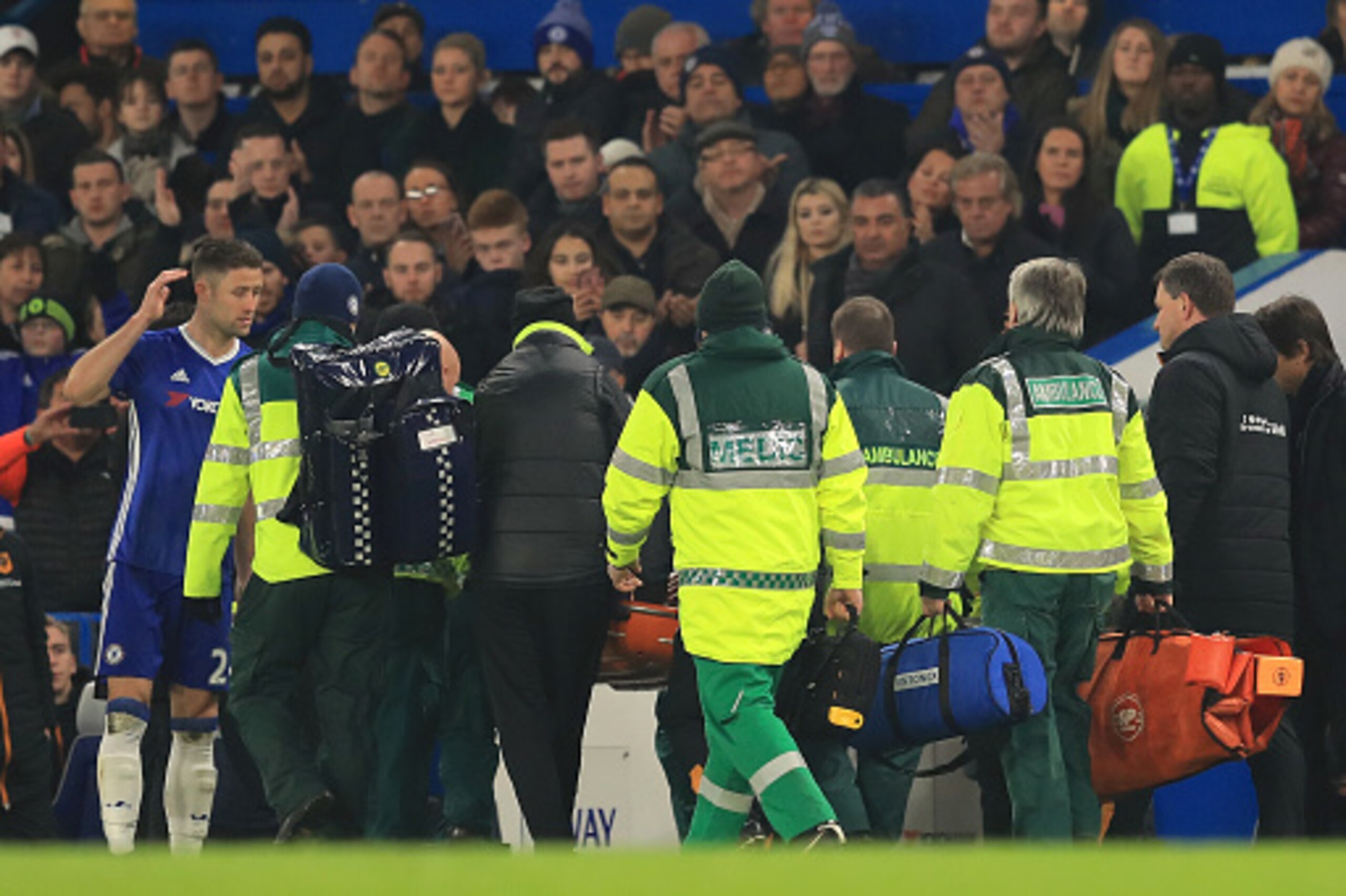 LONDON, ENGLAND - JANUARY 22:  Gary Cahill (1st L) of Chelsea looks on as Ryan Mason of Hull City is stretched off during the Premier League match between Chelsea and Hull City at Stamford Bridge on January 22, 2017 in London, England.  (Photo by Richard 