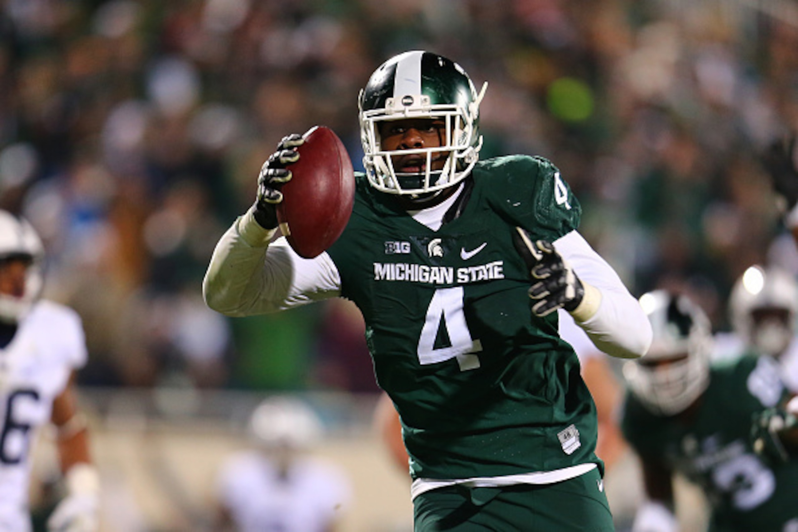EAST LANSING, MI - NOVEMBER 28: Malik McDowell #4 of the Michigan State Spartans intercepts a pass and returns it for the touchdown in the fourth quarter against the Penn State Nittany Lions at Spartan Stadium  on November 28, 2015 in East Lansing, Michig