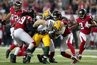 ATLANTA, GA - JANUARY 22:  Aaron Ripkowski #22 of the Green Bay Packers fumbles the ball in the second quarter after contact with Jalen Collins #32 of the Atlanta Falcons in the NFC Championship Game at the Georgia Dome on January 22, 2017 in Atlanta, Geo