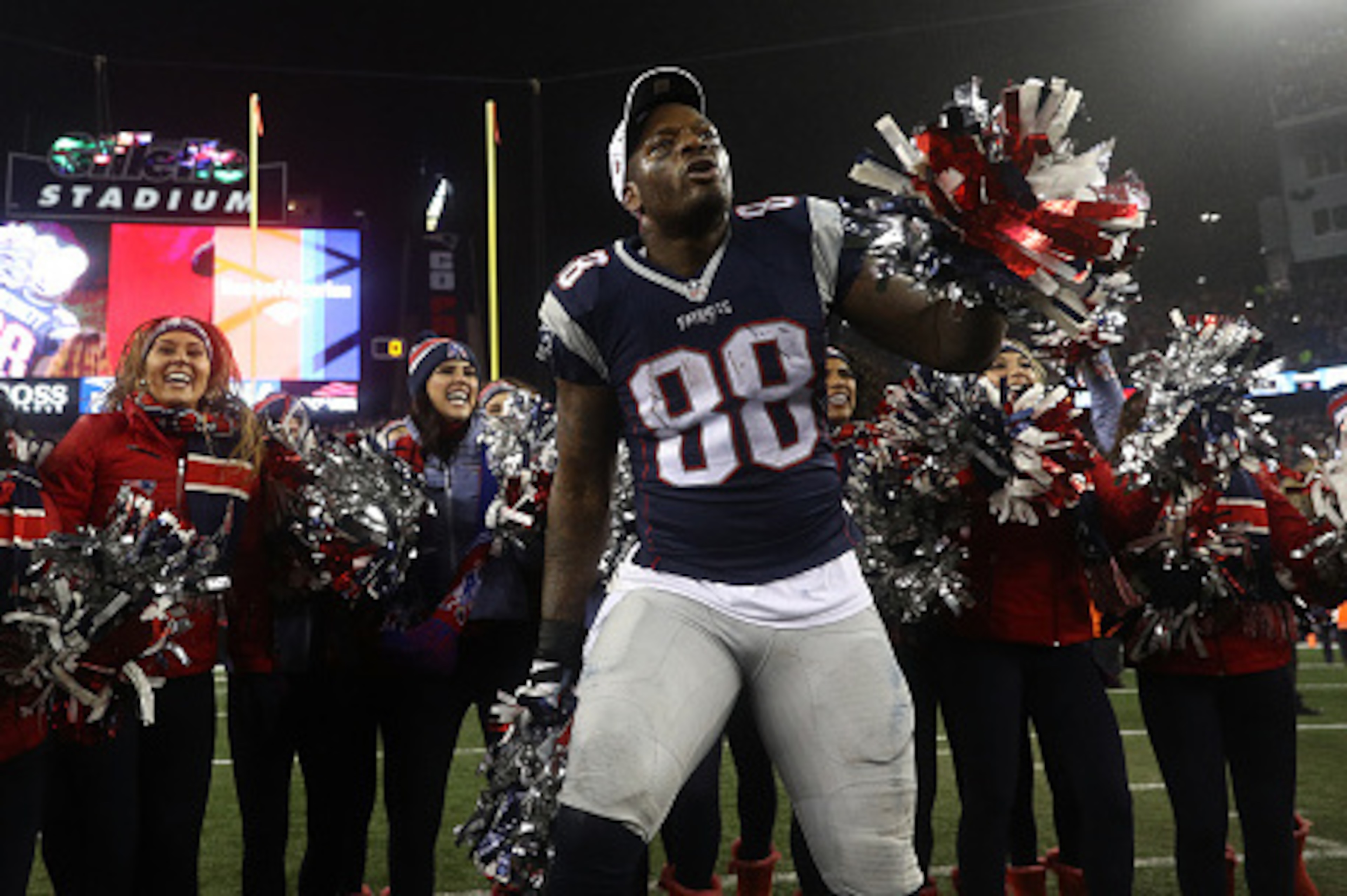 FOXBORO, MA - JANUARY 22: Martellus Bennett #88 of the New England Patriots celebrates with cheerleaders after defeating the Pittsburgh Steelers 36-17 to win the AFC Championship Game at Gillette Stadium on January 22, 2017 in Foxboro, Massachusetts. (Pho