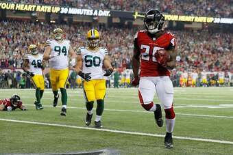 ATLANTA, GA - JANUARY 22:  Tevin Coleman #26 of the Atlanta Falcons scores a three yard touchdown in the fourth quarter against the Green Bay Packers  in the NFC Championship Game at the Georgia Dome on January 22, 2017 in Atlanta, Georgia.  (Photo by Kev