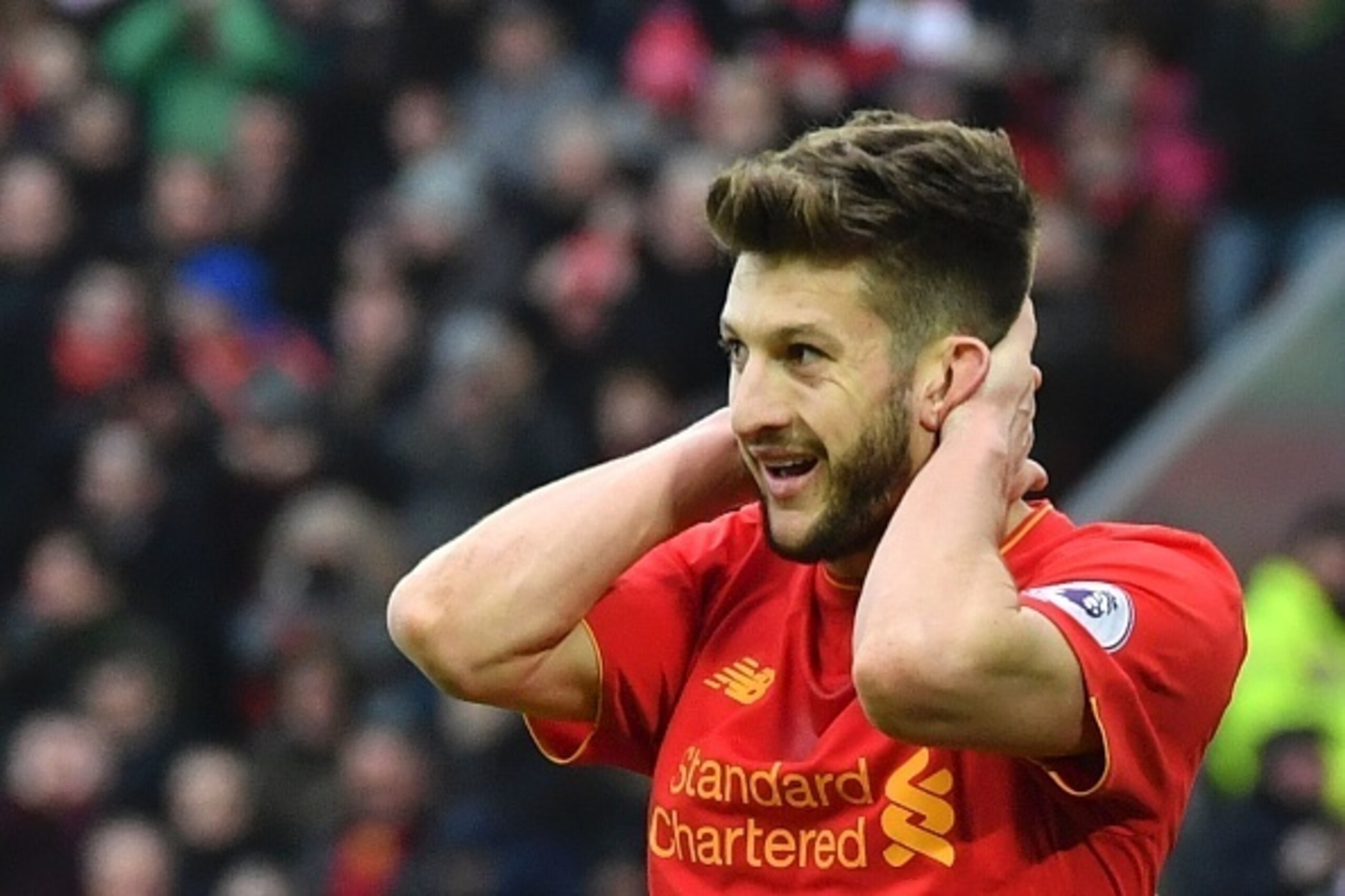 Liverpool's English midfielder Adam Lallana reacts after a missed chance during the English Premier League football match between Liverpool and Swansea City at Anfield in Liverpool, north west England on January 21, 2017. / AFP / Anthony DEVLIN / RESTRICT