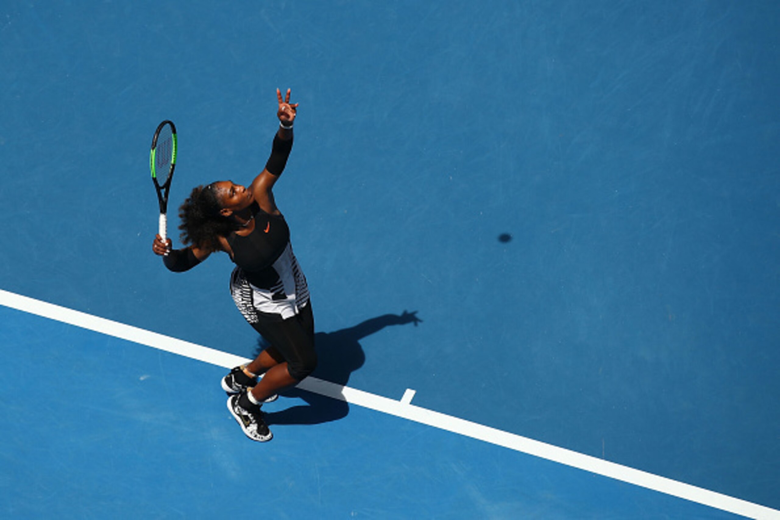 MELBOURNE, AUSTRALIA - JANUARY 23:  Serena Williams of the United States serves in her fourth round match against Barbora Strycova of the Czech Republic on day eight of the 2017 Australian Open at Melbourne Park on January 23, 2017 in Melbourne, Australia