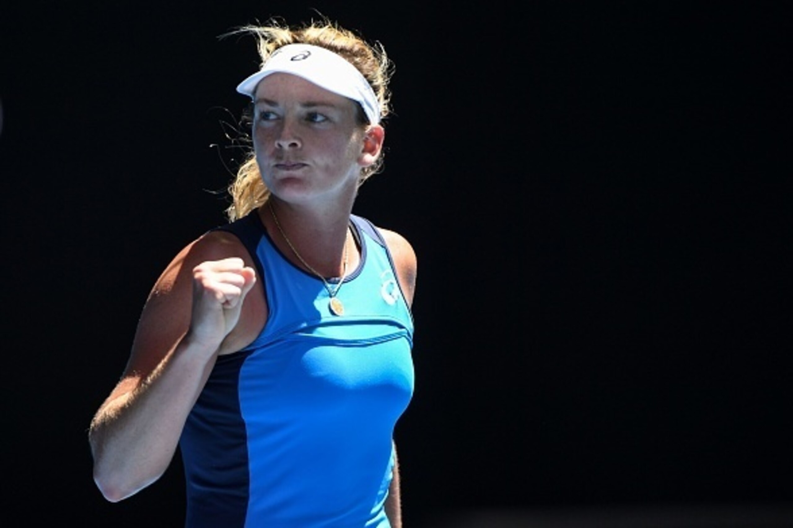 Coco Vandeweghe of the US celebrates her victory against Spain's Garbine Muguruza during their women's singles quarter-final match on day nine of the Australian Open tennis tournament in Melbourne on January 24, 2017. / AFP / WILLIAM WEST / IMAGE RESTRICT