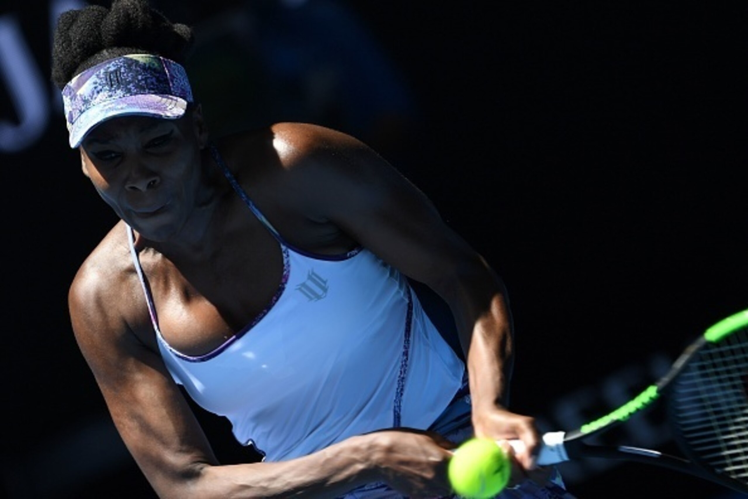 Venus Williams of the US hits a return against Russia's Anastasia Pavlyuchenkova during their women's singles quarter-final match on day nine of the Australian Open tennis tournament in Melbourne on January 24, 2017.  / AFP / GREG WOOD / IMAGE RESTRICTED 