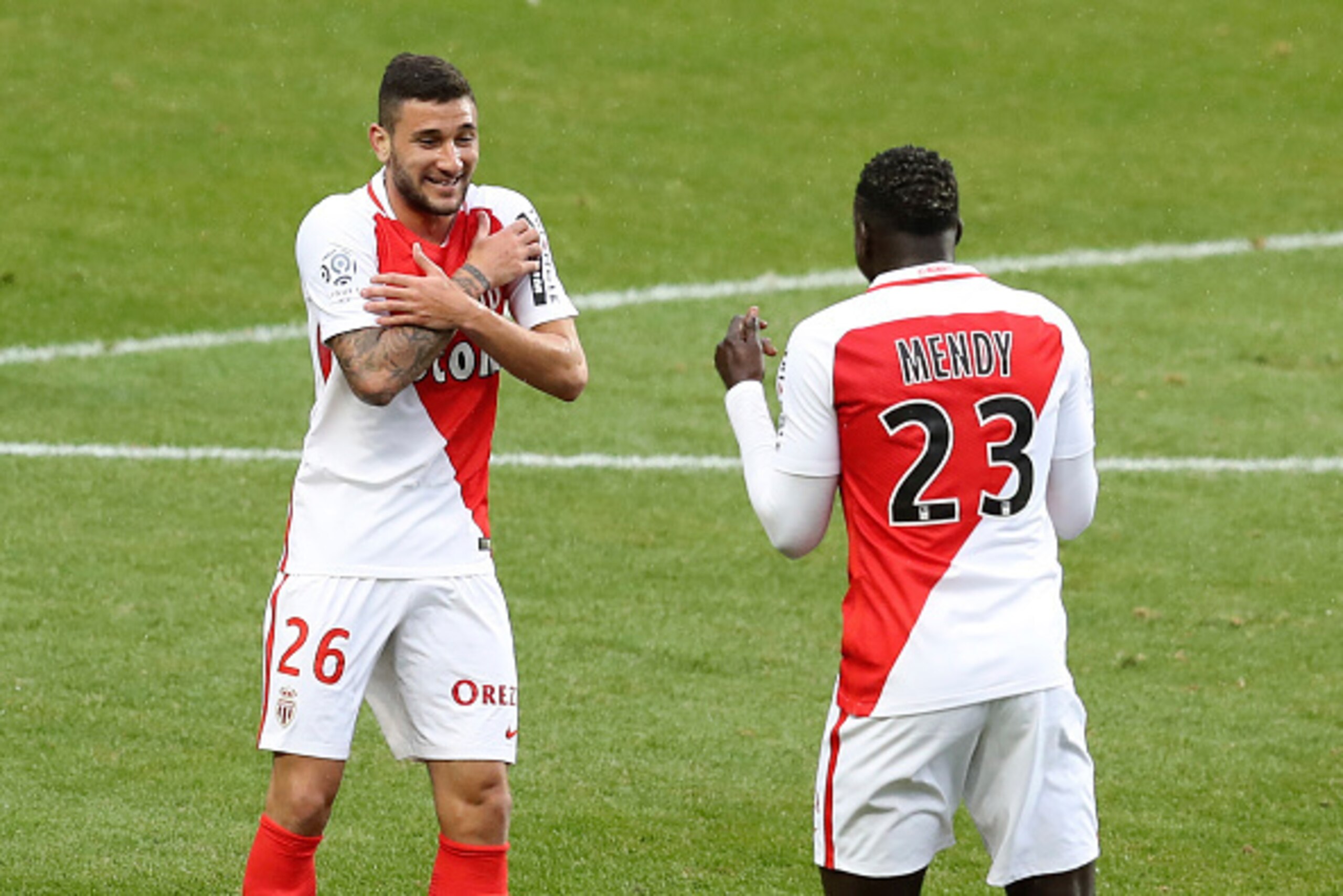 Monaco's Brazilian mildfielder Gabriel Boschilia (L) celebrates with Monaco's French defender Benjamin Mendy after scoring a goal during the French L1 football match between Monaco (ASM) and Lorient (FCL) on January 22, 2017 at the Louis II Stadium in Mon