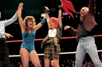 Wendi Richter, Cyndi Lauper and Dave Wolff celebrate at WrestleMania.