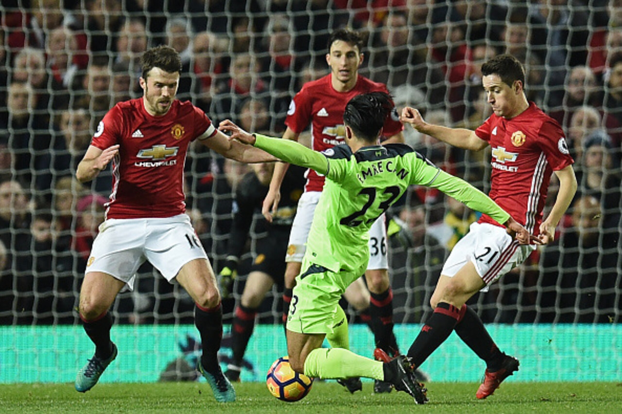 Liverpool's German midfielder Emre Can (C) vies with Manchester United's English midfielder Michael Carrick, (L) Manchester United's Italian defender Matteo Darmian (2L) and Manchester United's Spanish midfielder Ander Herrera during the English Premier L