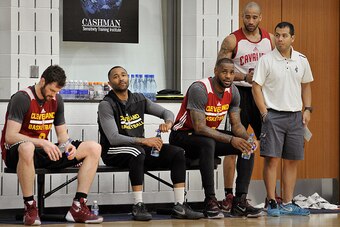 INDEPENDENCE, OH - APRIL 28:  Kevin Love #0, Mo Williams #52, LeBron James #23 and Dahntay Jones #30 of the Cleveland Cavaliers sit on the bench during an all access practice at The Cleveland Clinic Courts on April 28, 2016 in Independence, Ohio. NOTE TO 