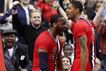 WASHINGTON, DC - JANUARY 24:  John Wall #2 and Bradley Beal #3 of the Washington Wizards celebrate after Beal was fouled and made the shot during the closing mintues of the Wizards 123-108 win over the Boston Celtics at Verizon Center on January 24, 2017 