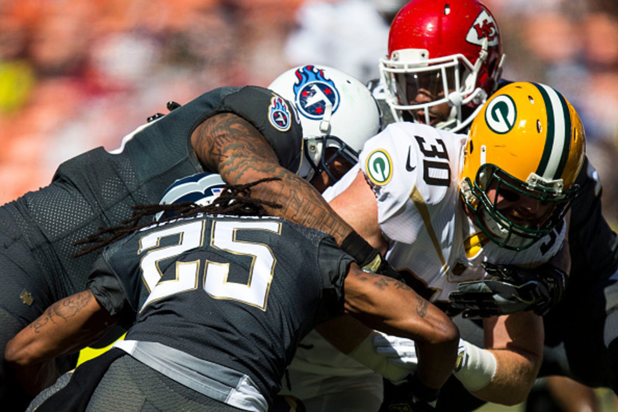 HONOLULU, HI -  SUNDAY, JANUARY 31:  Team Rice fullback John Kuhn #30 of the Green Bay Packers carries the ball against Team Irvin during the first half of the 2016 NFL Pro Bowl at Aloha Stadium on January 31, 2016 in Honolulu, Hawaii.Team Irvin defeated 