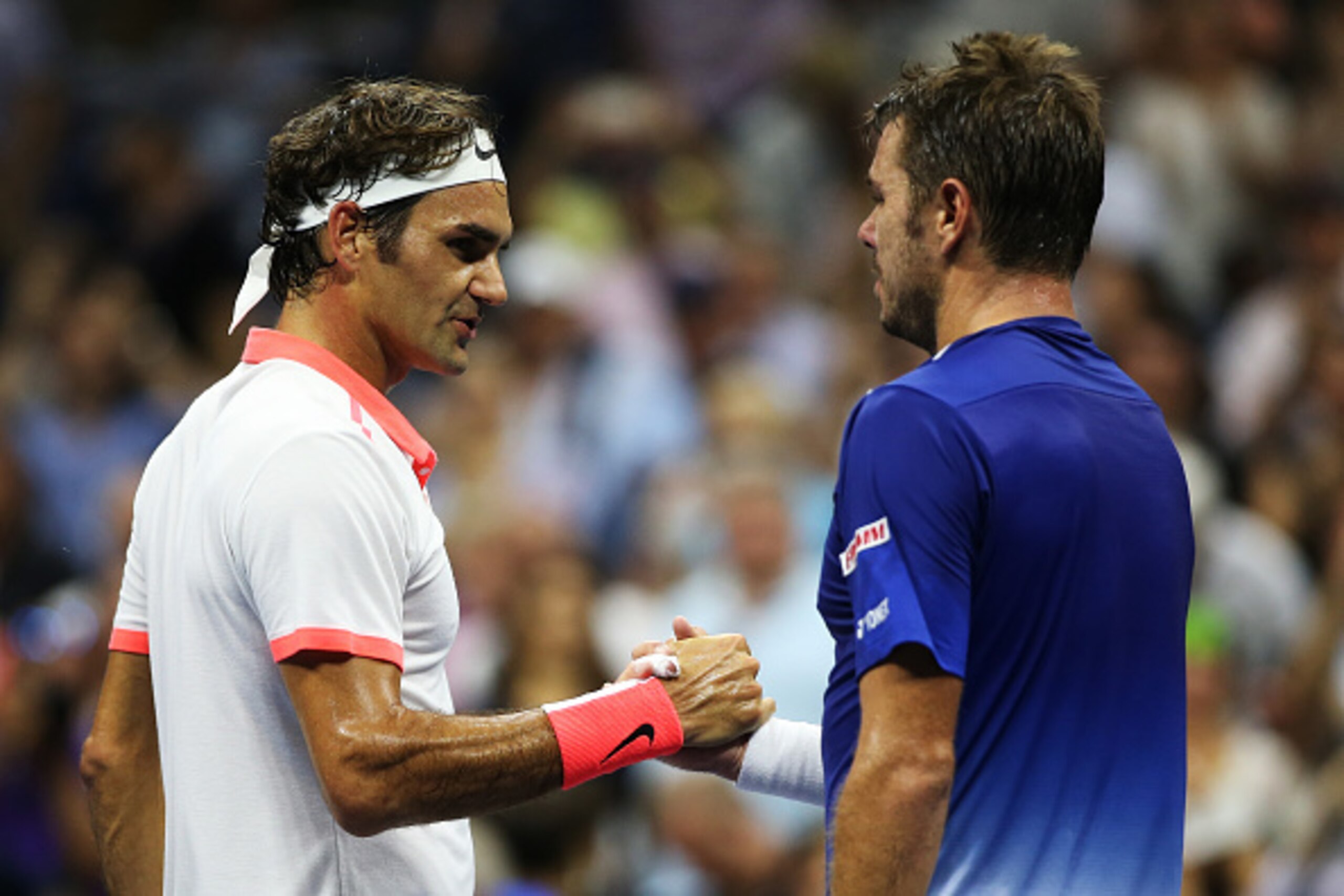 NEW YORK, NY - SEPTEMBER 11:  (L-R) Roger Federer of Switzerland shakes hands with Stan Wawrinka of Switzerland after their Men's Singles Semifinals match on Day Twelve of the 2015 US Open at the USTA Billie Jean King National Tennis Center on September 1