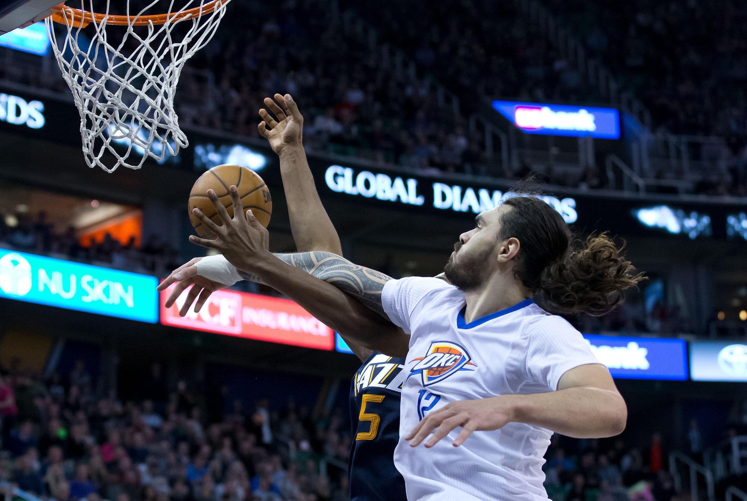 Jan 23, 2017; Salt Lake City, UT, USA; Oklahoma City Thunder center Steven Adams (12) defends against the shot of Utah Jazz forward Derrick Favors (15) during the second half at Vivint Smart Home Arena. Oklahoma City won 97-95. Mandatory Credit: Russ Isab Jan 23, 2017; Salt Lake City, UT, USA; Oklahoma City Thunder center Steven Adams (12) defends against the shot of Utah Jazz forward Derrick Favors (15) during the second half at Vivint Smart Home Arena. Oklahoma City won 97-95. Mandatory Credit: Russ Isab