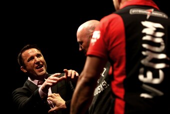 LAS VEGAS, NV - MAY 23: President Dana White steps between opponents Chael Sonnen (L) and Wanderlei Silva (R) after a heated face off during the UFC 175 & The Ultimate Fighter Finale On-Sale Press Conference at the MGM Grand Garden Arena on May 23, 2014 i