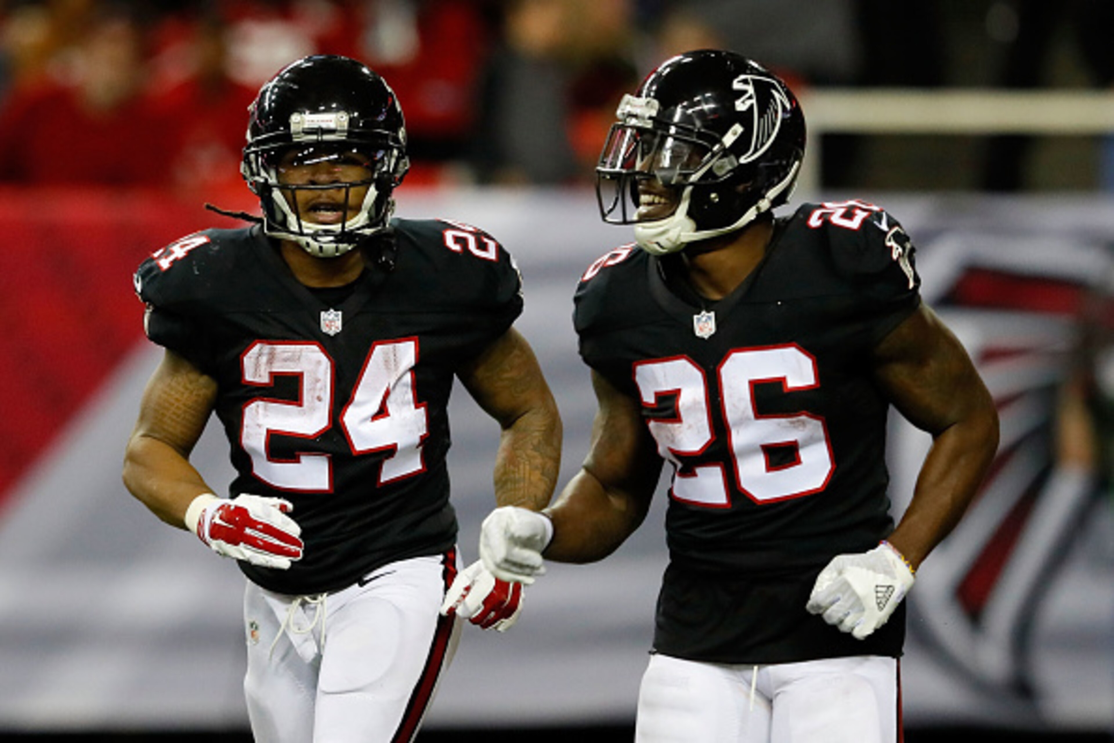 ATLANTA, GA - DECEMBER 18: Devonta Freeman #24 runs off the field with Tevin Coleman #26 of the Atlanta Falcons after scoring during the second half against the San Francisco 49ers at the Georgia Dome on December 18, 2016 in Atlanta, Georgia. (Photo by Ke
