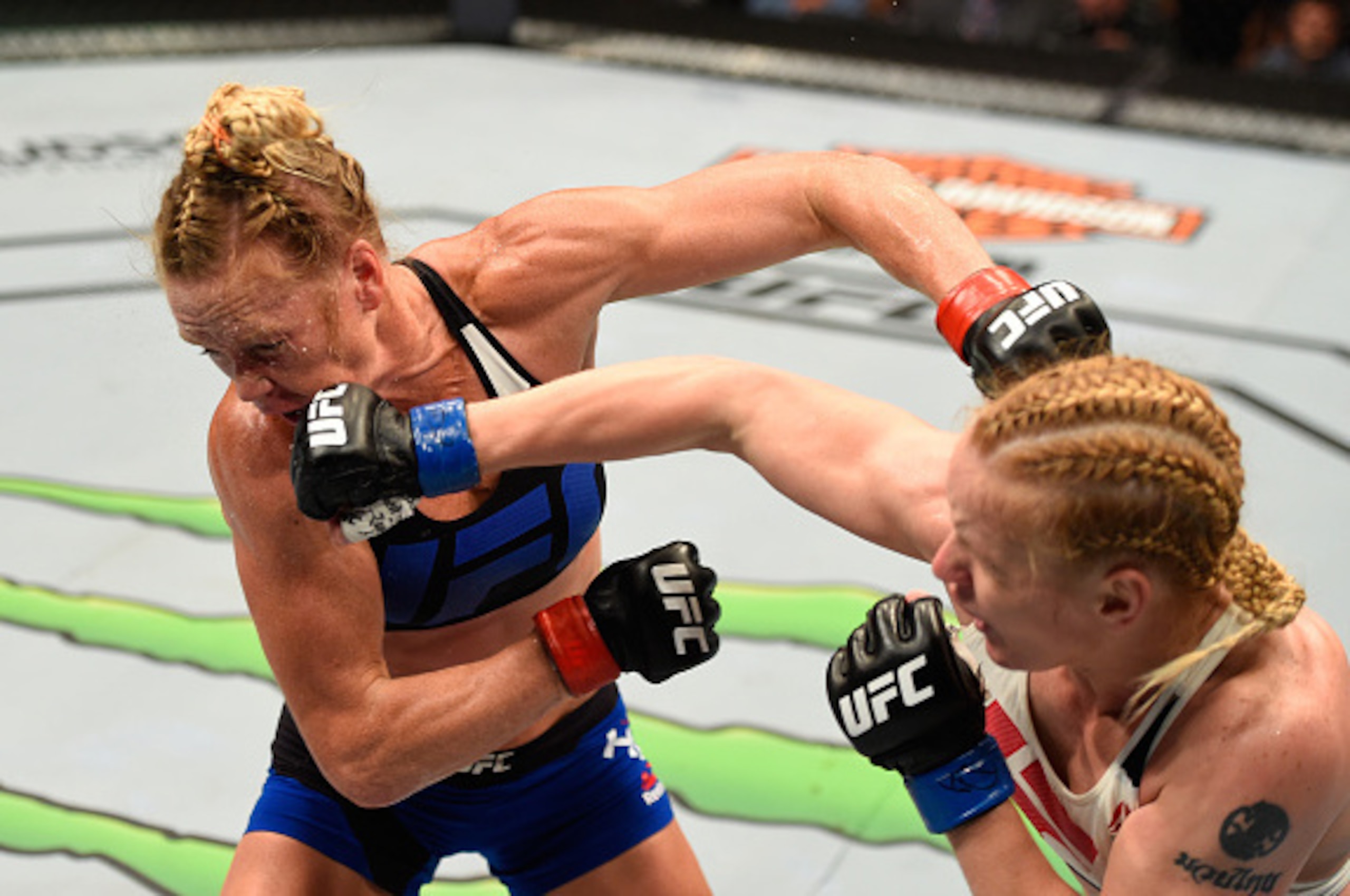 CHICAGO, IL - JULY 23: (R-L) Valentina Shevchenko of Kyrgyzstan punches Holly Holm in their women's bantamweight bout during the UFC Fight Night event at the United Center on July 23, 2016 in Chicago, Illinois. (Photo by Josh Hedges/Zuffa LLC/Zuffa LLC v CHICAGO, IL - JULY 23: (R-L) Valentina Shevchenko of Kyrgyzstan punches Holly Holm in their women's bantamweight bout during the UFC Fight Night event at the United Center on July 23, 2016 in Chicago, Illinois. (Photo by Josh Hedges/Zuffa LLC/Zuffa LLC v