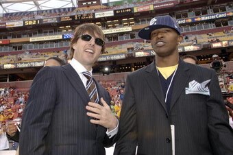 Jamie Foxx and Tom Cruise on the field prior to the Minnesota Vikings and Washington Redskins game at FedEx Field in Washington D.C. on September 11, 2006.  (Photo by A. Messerschmidt/Getty Images)