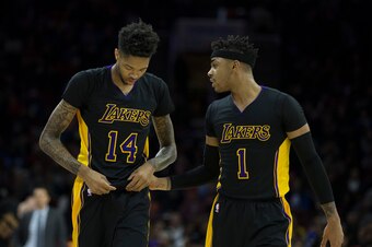 PHILADELPHIA, PA - DECEMBER 16: Brandon Ingram #14 and D'Angelo Russell #1 of the Los Angeles Lakers talk to each other after a timeout in the first quarter against the Philadelphia 76ers at Wells Fargo Center on December 16, 2016 in Philadelphia, Pennsyl