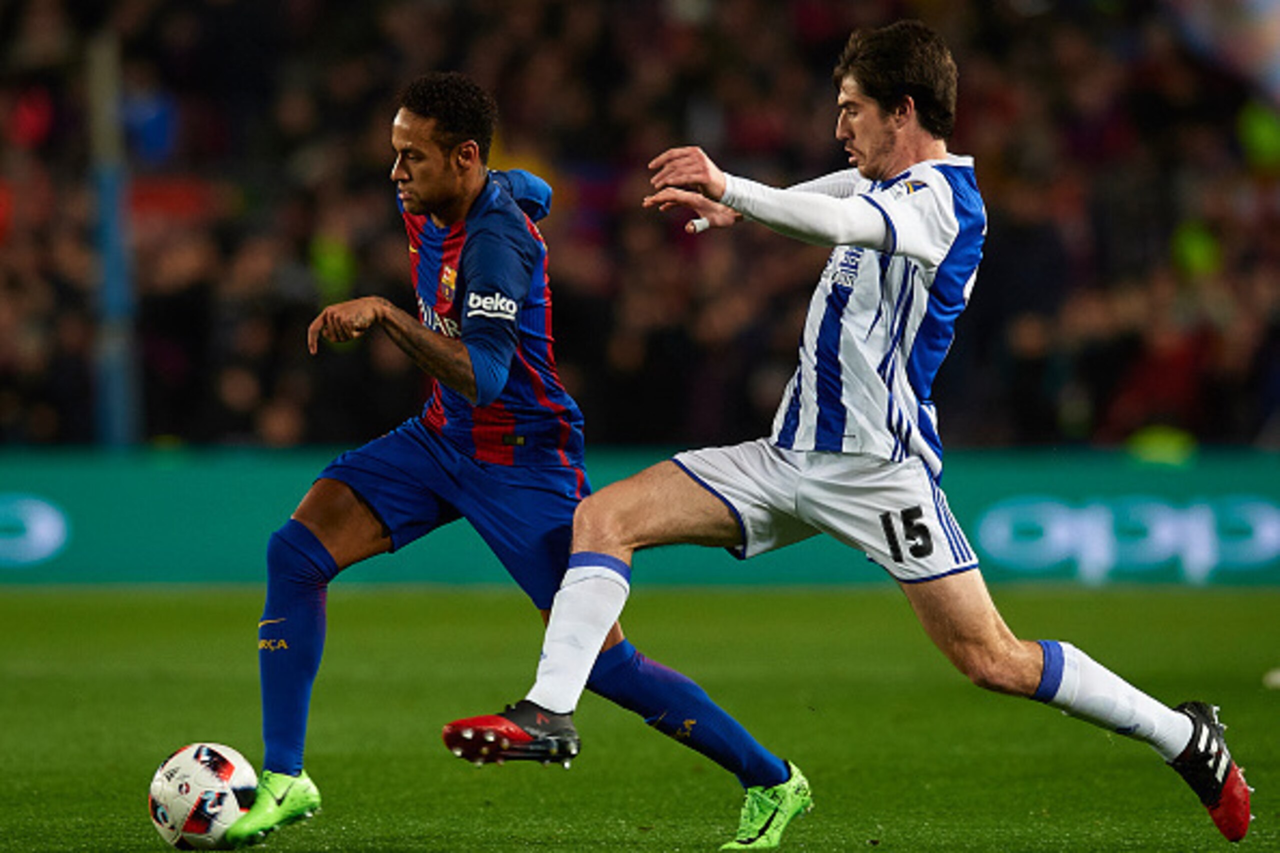 BARCELONA, SPAIN - JANUARY 26:  Neymar JR (L) of Barcelona is tackled by Aritz of Real Sociedad during the Copa del Rey quarter-final second leg match between FC Barcelona and Real Sociedad at Camp Nou on January 26, 2017 in Barcelona, Spain.  (Photo by M
