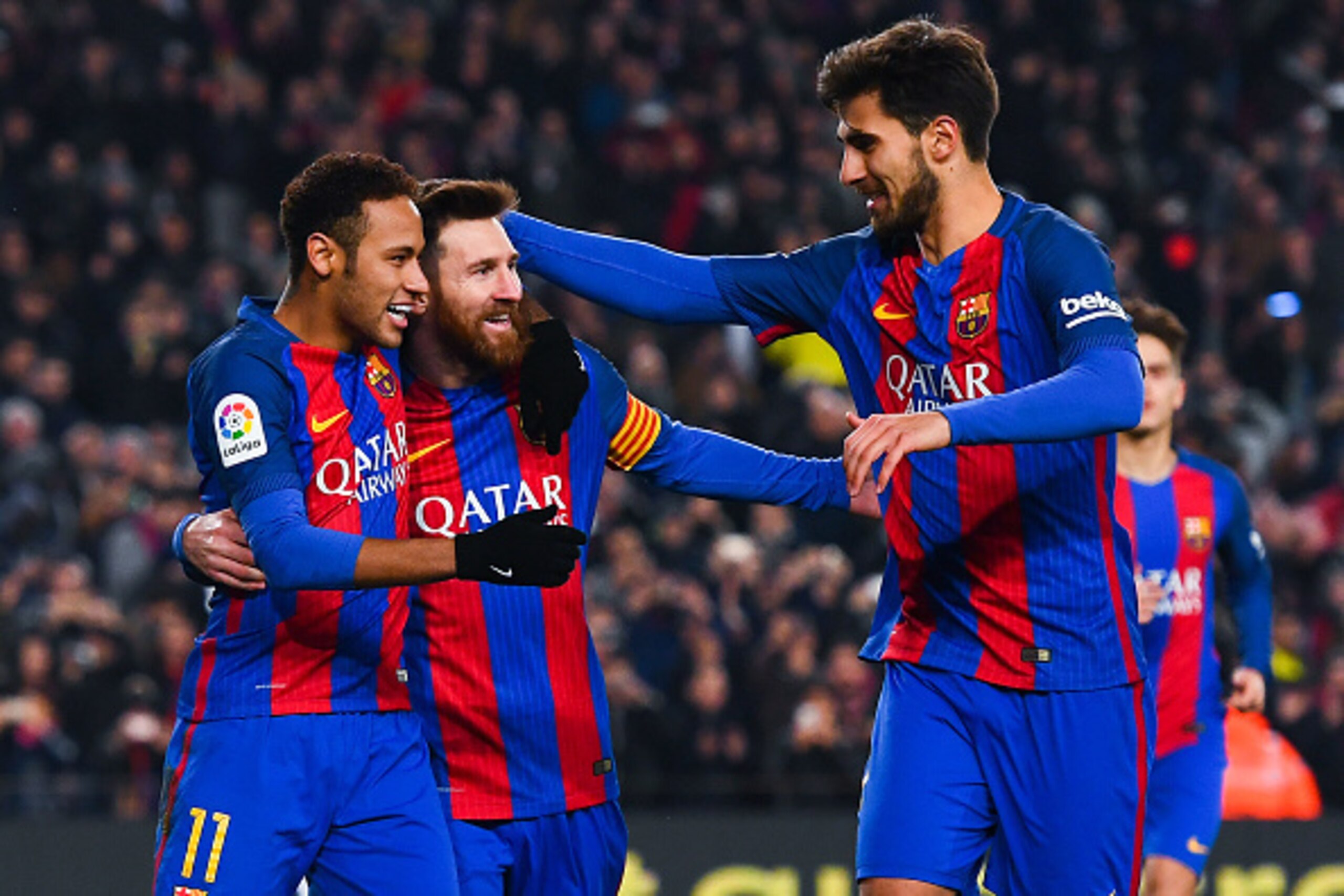 BARCELONA, SPAIN - JANUARY 26:  Lionel Messi (C) of FC Barcelona celebrates with his team mates Neymar Jr. (L) and Andre Gomes after scoring from the penalty spot his team's second goal during the Copa del Rey quarter-final second leg match between FC Bar