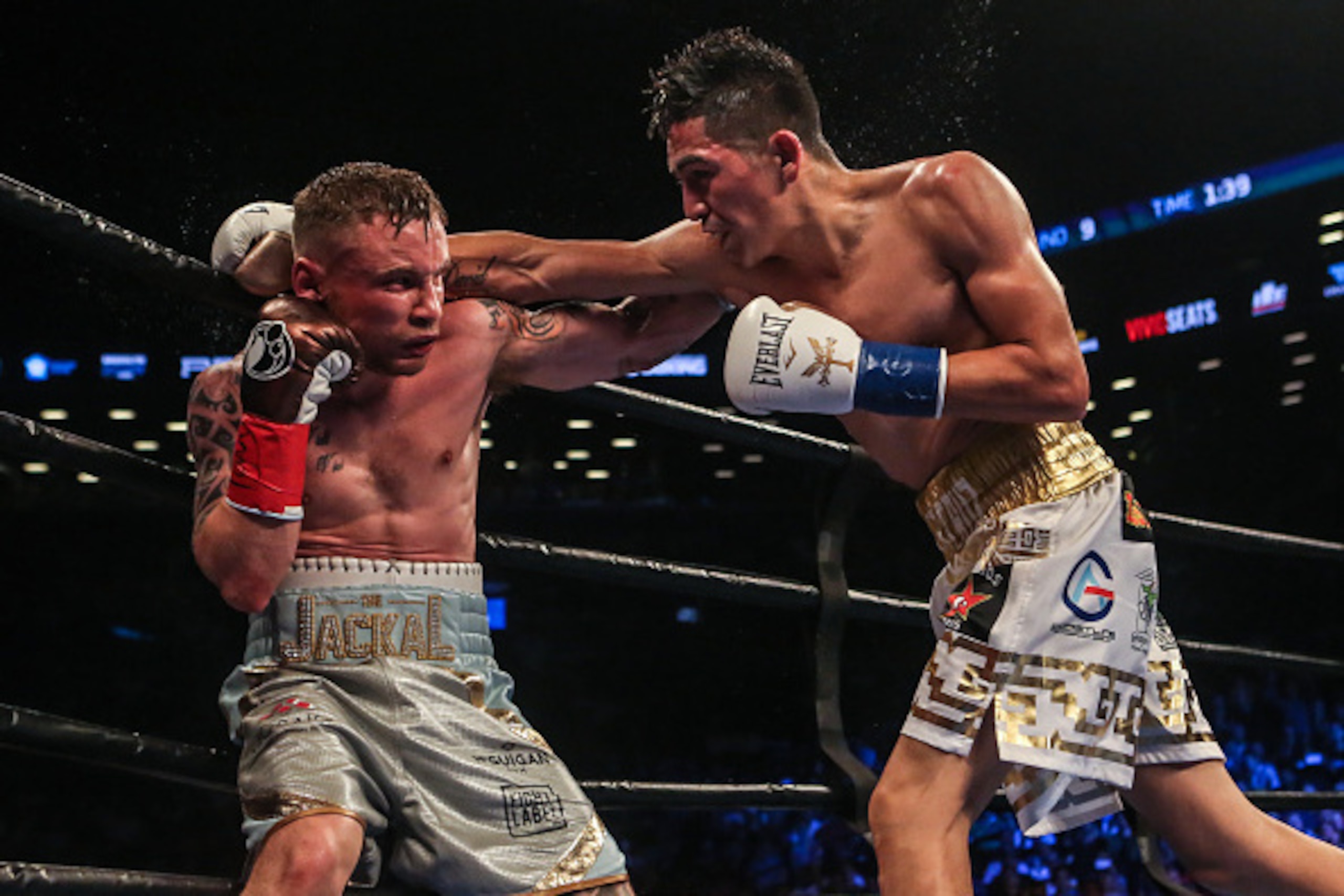 NEW YORK, NY - JULY 30:  Leo Santa Cruz of Mexico (gold trunks) fights Carl Frampton of Northern Ireland (blue trunks) during their  12 round WBA Super  featherweight championship  bout  at Barclays Center on July 30, 2016 in the Brooklyn borough in New Y