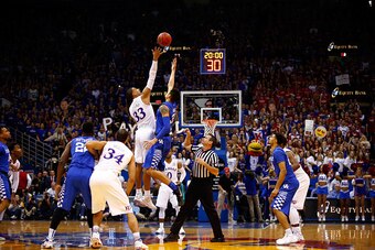 LAWRENCE, KS - JANUARY 30:  The opening tip off during the game between the Kentucky Wildcats and the Kansas Jayhawks at Allen Fieldhouse on January 30, 2016 in Lawrence, Kansas.  (Photo by Jamie Squire/Getty Images)