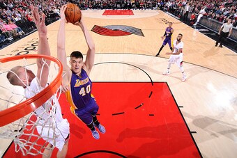 PORTLAND, OR - JANUARY 25: Ivica Zubac #40 of the Los Angeles Lakers goes for the dunk during the game against the Portland Trail Blazers on January 25, 2017 at the Moda Center in Portland, Oregon. NOTE TO USER: User expressly acknowledges and agrees that