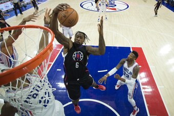 PHILADELPHIA, PA - JANUARY 24: DeAndre Jordan #6 of the Los Angeles Clippers and Richaun Holmes #22 of the Philadelphia 76ers reach for the ball at the Wells Fargo Center on January 24, 2017 in Philadelphia, Pennsylvania. The 76ers defeated the Clippers 1