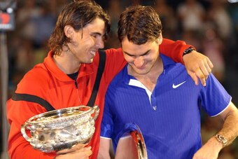 TO GO WITH Tennis-Open-AUS-men by Robert Smith (FILES) This file photo taken early on February 2, 2009 shows winner Rafael Nadal (L) of Spain putting his arm around runner-up Roger Federer of Switzerland after the men's tennis final on day 14 of the Austr