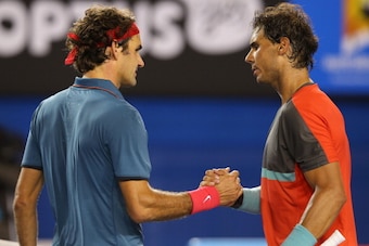 MELBOURNE, AUSTRALIA - JANUARY 24: Rafael Nadal of Spain shakes hands with Roger Federer of Switzerland after Nadal won their semifinal match during day 12 of the 2014 Australian Open at Melbourne Park on January 24, 2014 in Melbourne, Australia.  (Photo 