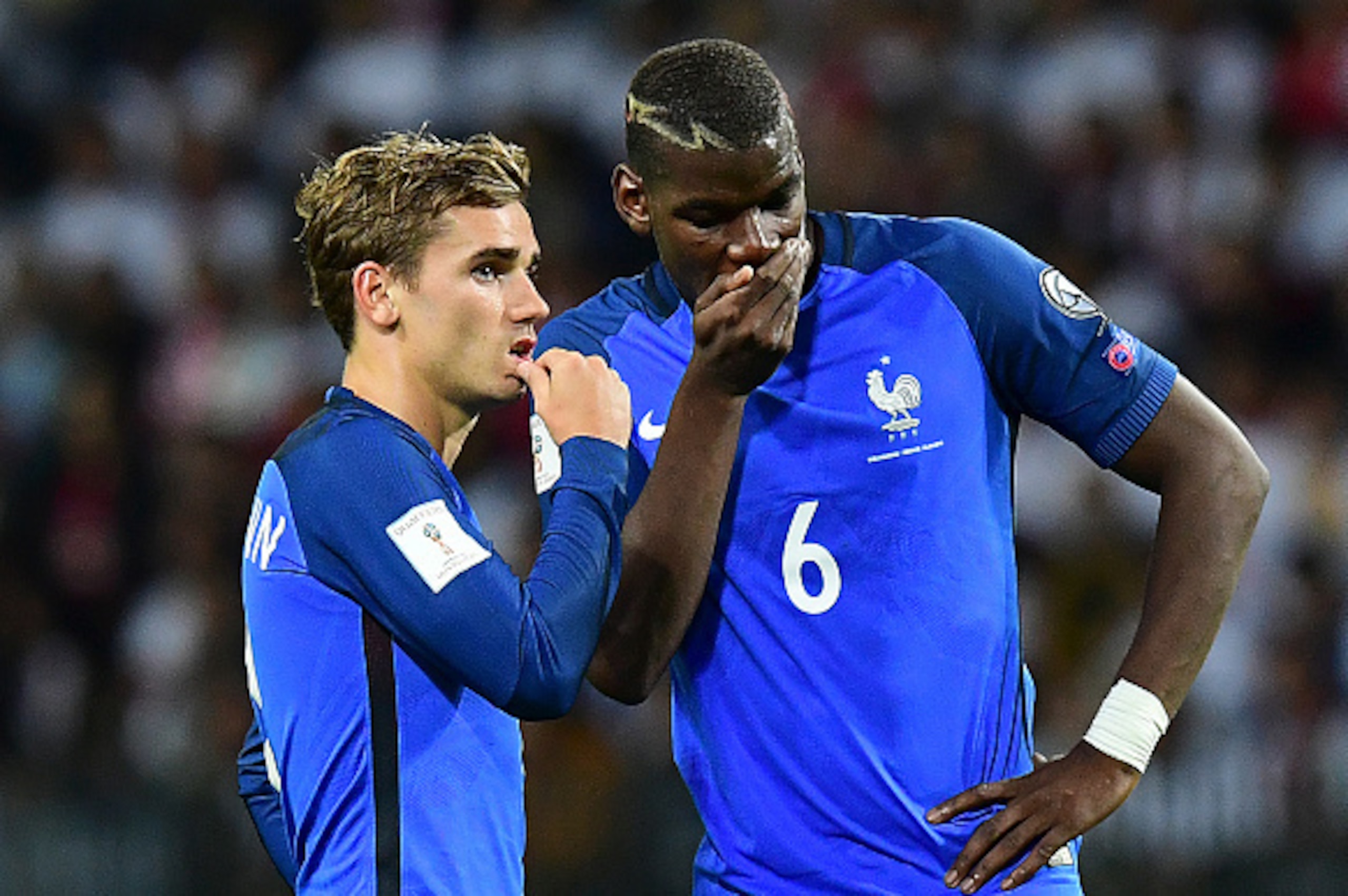 France's forward Antoine Griezmann (L) speaks with France's midfielder Paul Pogba during the FIFA World Cup 2018 qualifying football match Belarus vs France on September 6, 2016 at the Borisov Arena in Borisov.   / AFP / FRANCK FIFE        (Photo credit s