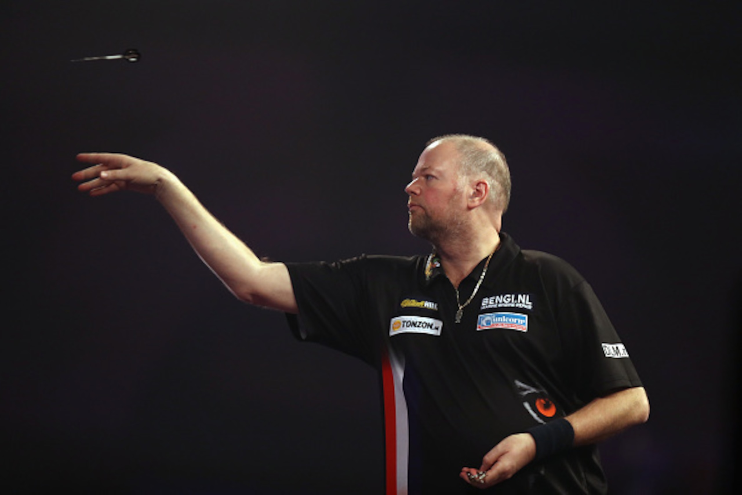 LONDON, ENGLAND - JANUARY 01:  Raymond van Barneveld of The Netherlands throws against Michael van Gerwen of The Netherlands on day fourteen of the 2017 William Hill PDC World Darts Championships at Alexandra Palace on January 1, 2017 in London, England. 