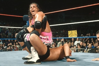 Bret Hart clams the Sharpshooter on Steve Austin.