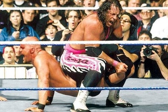 A bloody Steve Austin suffers through Bret Hart's Sharpshooter.