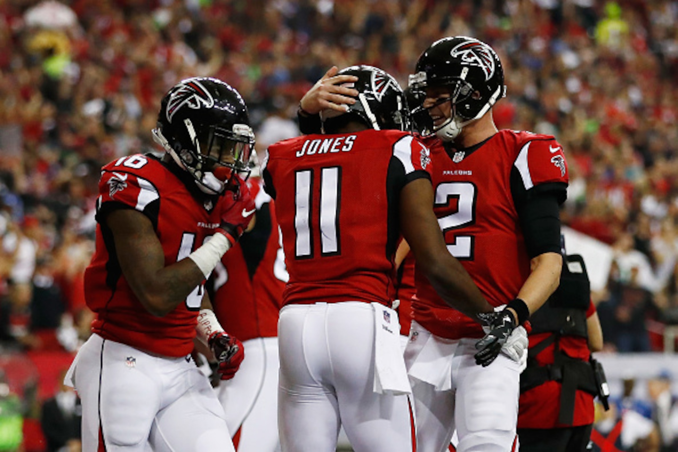 ATLANTA, GA - JANUARY 14:   Matt Ryan #2 of the Atlanta Falcons and  Julio Jones #11 of the Atlanta Falcons react after a touchdown agianst the Seattle Seahawks at the Georgia Dome on January 14, 2017 in Atlanta, Georgia.  (Photo by Gregory Shamus/Getty I