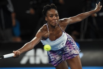 Venus Williams of the US hits a return against Serena Williams of the US during the women's singles final on day 13 of the Australian Open tennis tournament in Melbourne on January 28, 2017. / AFP / PAUL CROCK / IMAGE RESTRICTED TO EDITORIAL USE - STRICTL
