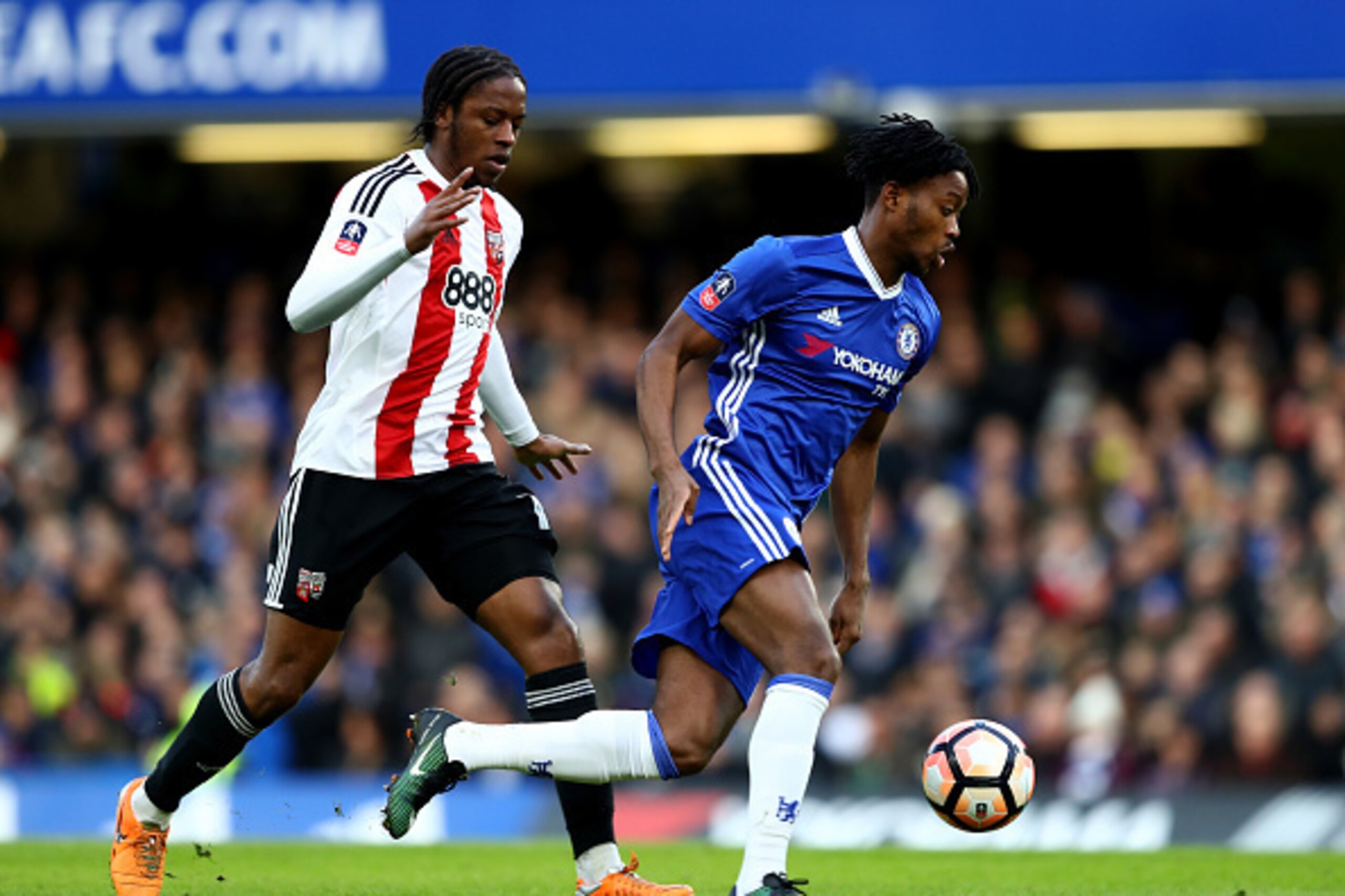 LONDON, ENGLAND - JANUARY 28: Michy Batshuayi of Chelsea and Romaine Sawyers of Brentford compete for the ball during the Emirates FA Cup Fourth Round match between Chelsea and Brentford at Stamford Bridge on January 28, 2017 in London, England.  (Photo b