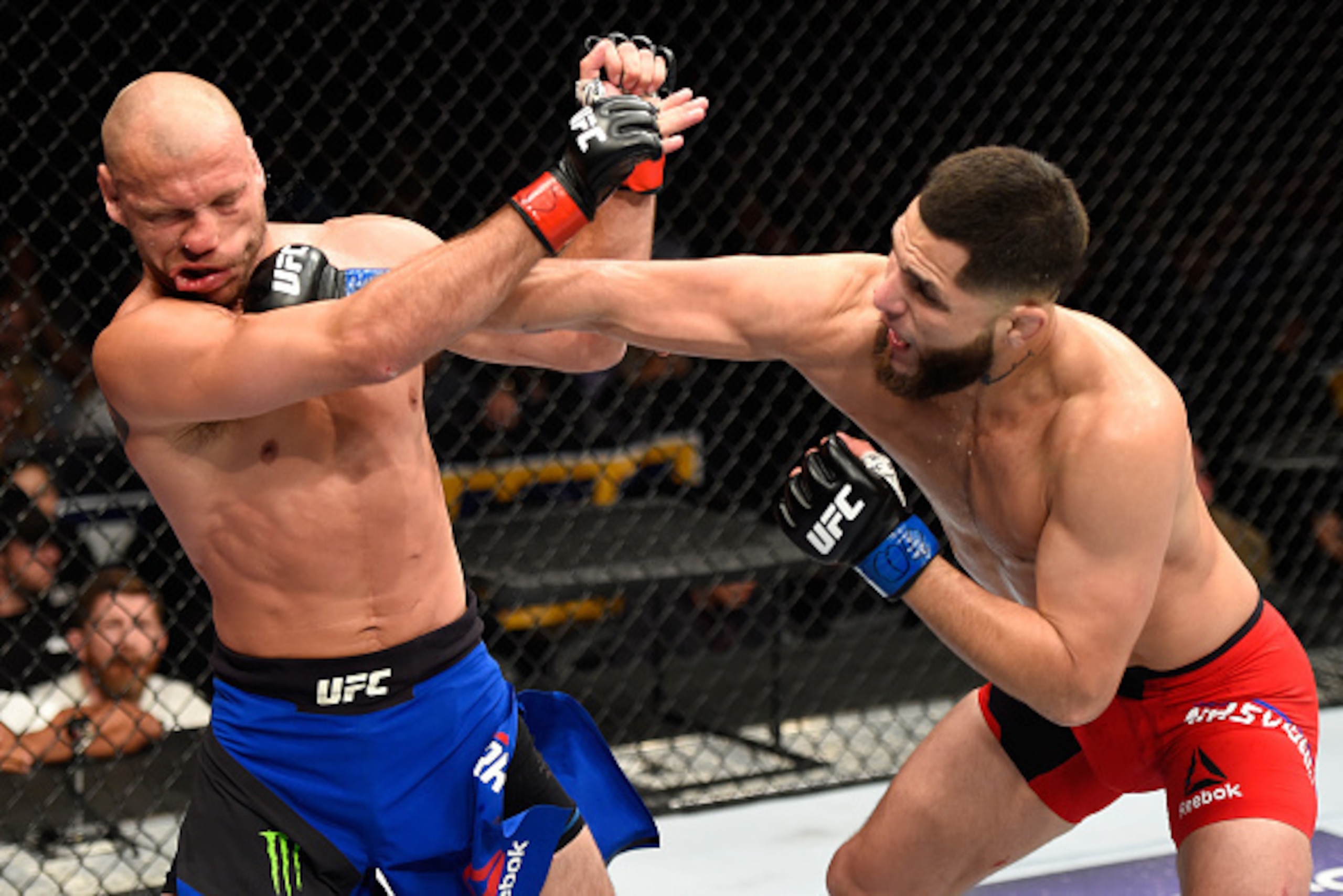 DENVER, CO - JANUARY 28:  (R-L) Jorge Masvidal punches Donald Cerrone in their welterweight bout during the UFC Fight Night event at the Pepsi Center on January 28, 2017 in Denver, Colorado. (Photo by Josh Hedges/Zuffa LLC/Zuffa LLC via Getty Images)