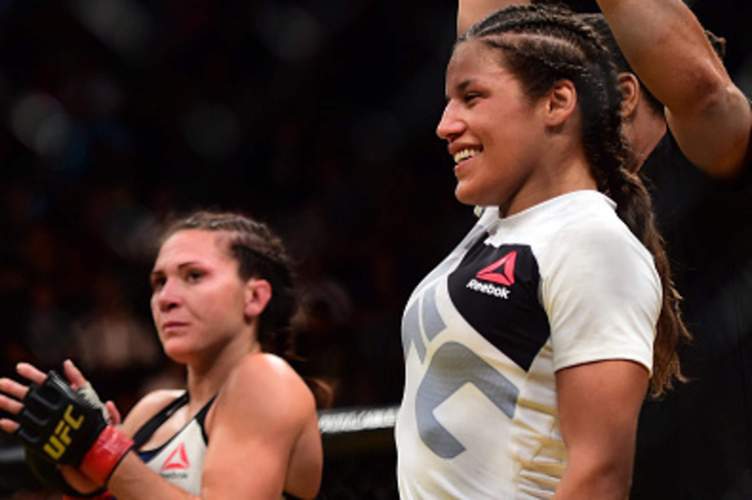 LAS VEGAS, NV - JULY 09:  Julianna Pena (right) reacts to her victory over Cat Zingano (left) in their women's bantamweight bout during the UFC 200 event on July 9, 2016 at T-Mobile Arena in Las Vegas, Nevada.  (Photo by Harry How/Zuffa LLC/Zuffa LLC via 