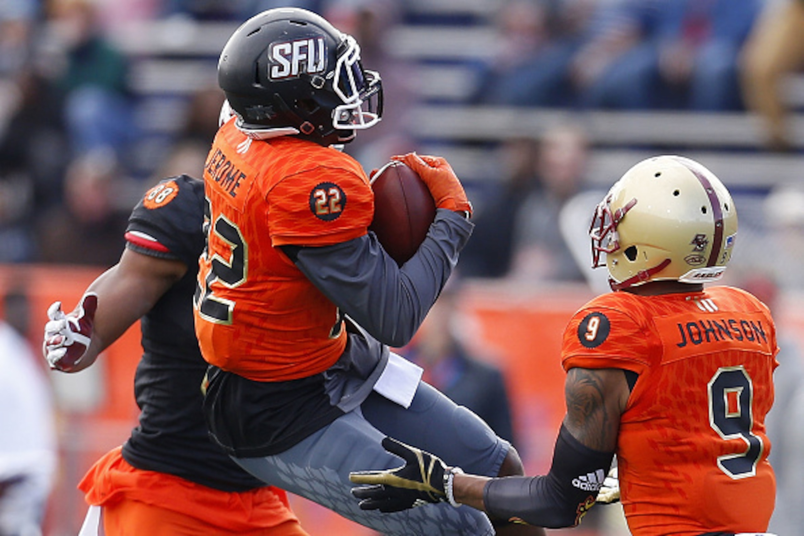 MOBILE, AL - JANUARY 28: Lorenzo Jerome #22 of the North team intercepts the ball as O.J. Howard #88 of the South team defends during the first half of the Reese's Senior Bowl at the Ladd-Peebles Stadium on January 28, 2017 in Mobile, Alabama.  (Photo by 