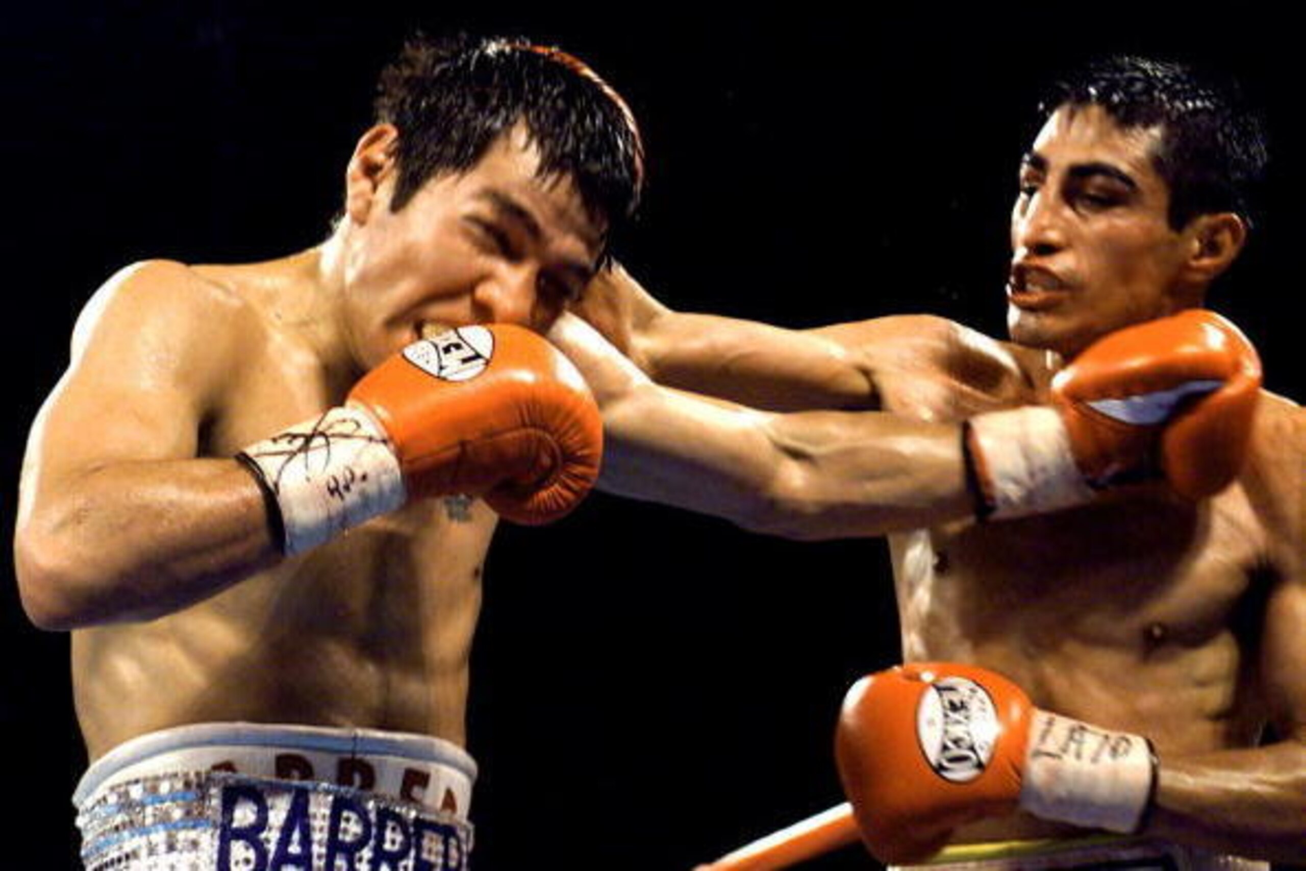 LAS VEGAS, : WBC Super Bantamweight Champion Erik Morales of Tijuana, Mexico, lands a right to the head of WBO Super Welterweight Champion Marco Antonio Barrera, of Mexico City, Mexico, late 19 February, 2000 at the Mandalay Bay Hotel in Las Vegas, NV. M LAS VEGAS, : WBC Super Bantamweight Champion Erik Morales of Tijuana, Mexico, lands a right to the head of WBO Super Welterweight Champion Marco Antonio Barrera, of Mexico City, Mexico, late 19 February, 2000 at the Mandalay Bay Hotel in Las Vegas, NV. M