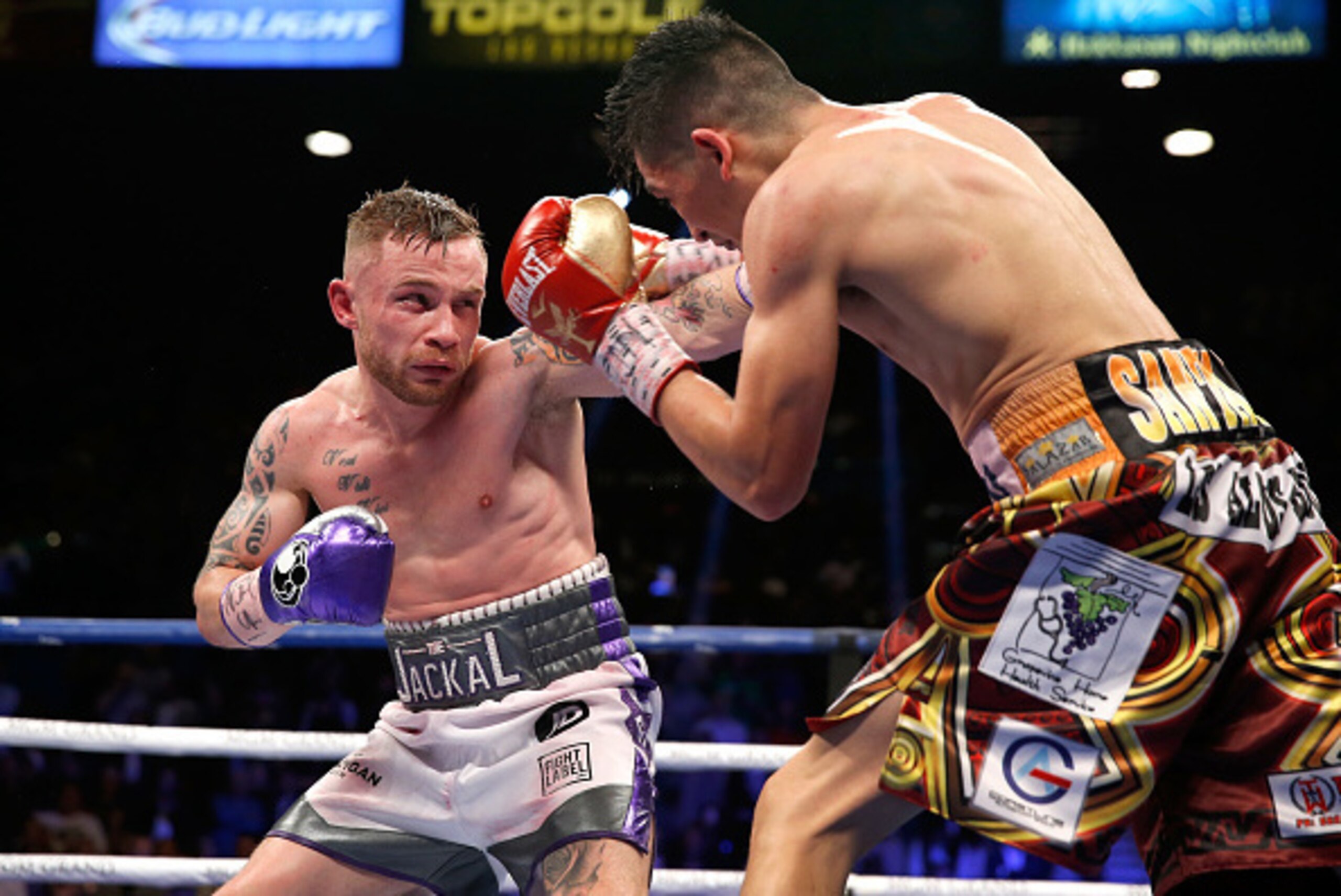 LAS VEGAS, NV - JANUARY 28: Carl Frampton (L) punches Leo Santa Cruz during the 12th round of their WBA featherweight title fight at MGM Grand Garden Arena on January 28, 2017 in Las Vegas, Nevada. Cruz took Frampton's title with a majority decision win. LAS VEGAS, NV - JANUARY 28: Carl Frampton (L) punches Leo Santa Cruz during the 12th round of their WBA featherweight title fight at MGM Grand Garden Arena on January 28, 2017 in Las Vegas, Nevada. Cruz took Frampton's title with a majority decision win.