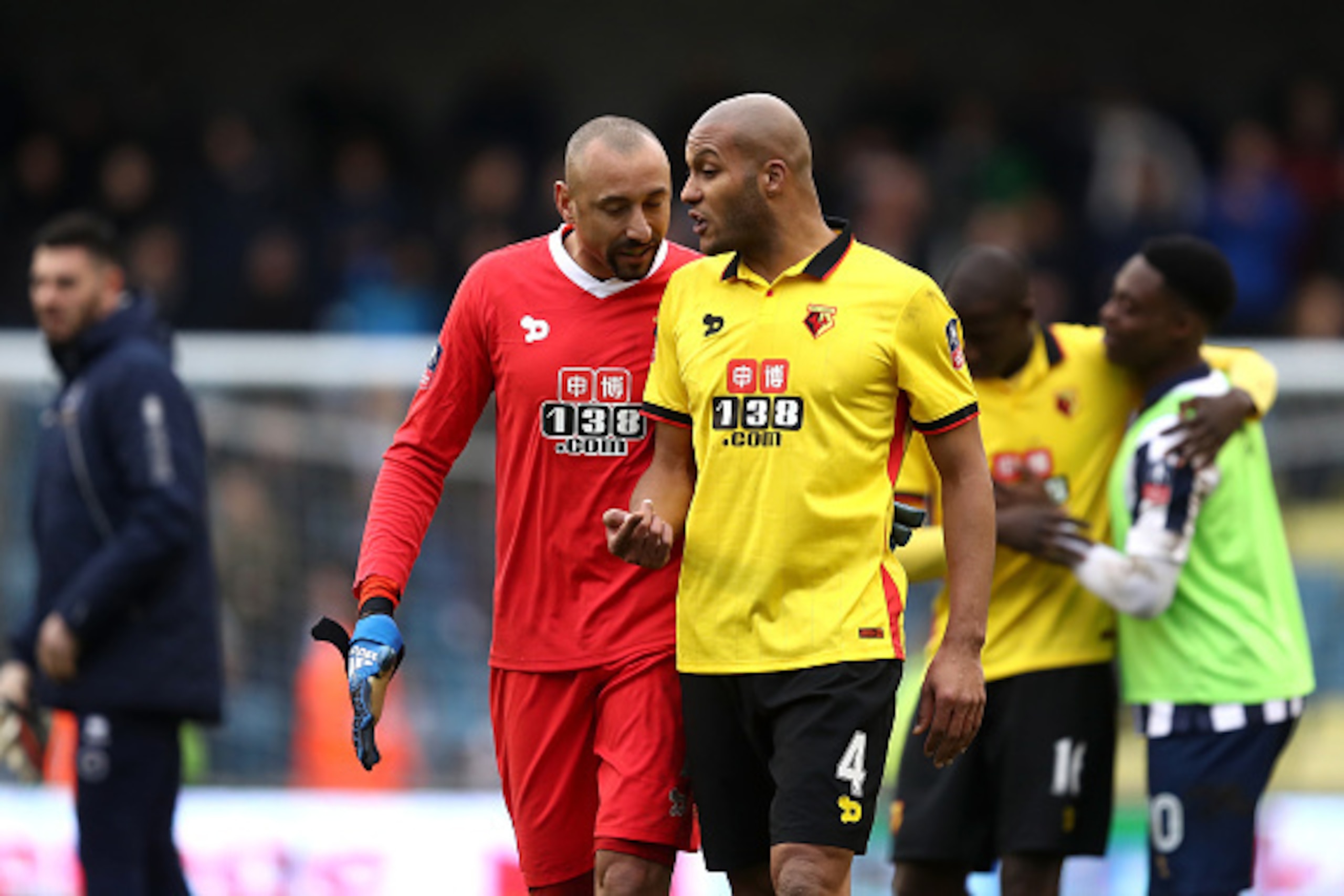LONDON, ENGLAND - JANUARY 29: Heurelho Gomes of Watford (L) speaks to Younes Kaboul of Watford (R) after The Emirates FA Cup Fourth Round match between Millwall and Watford at The Den on January 29, 2017 in London, England.  (Photo by Julian Finney/Getty 