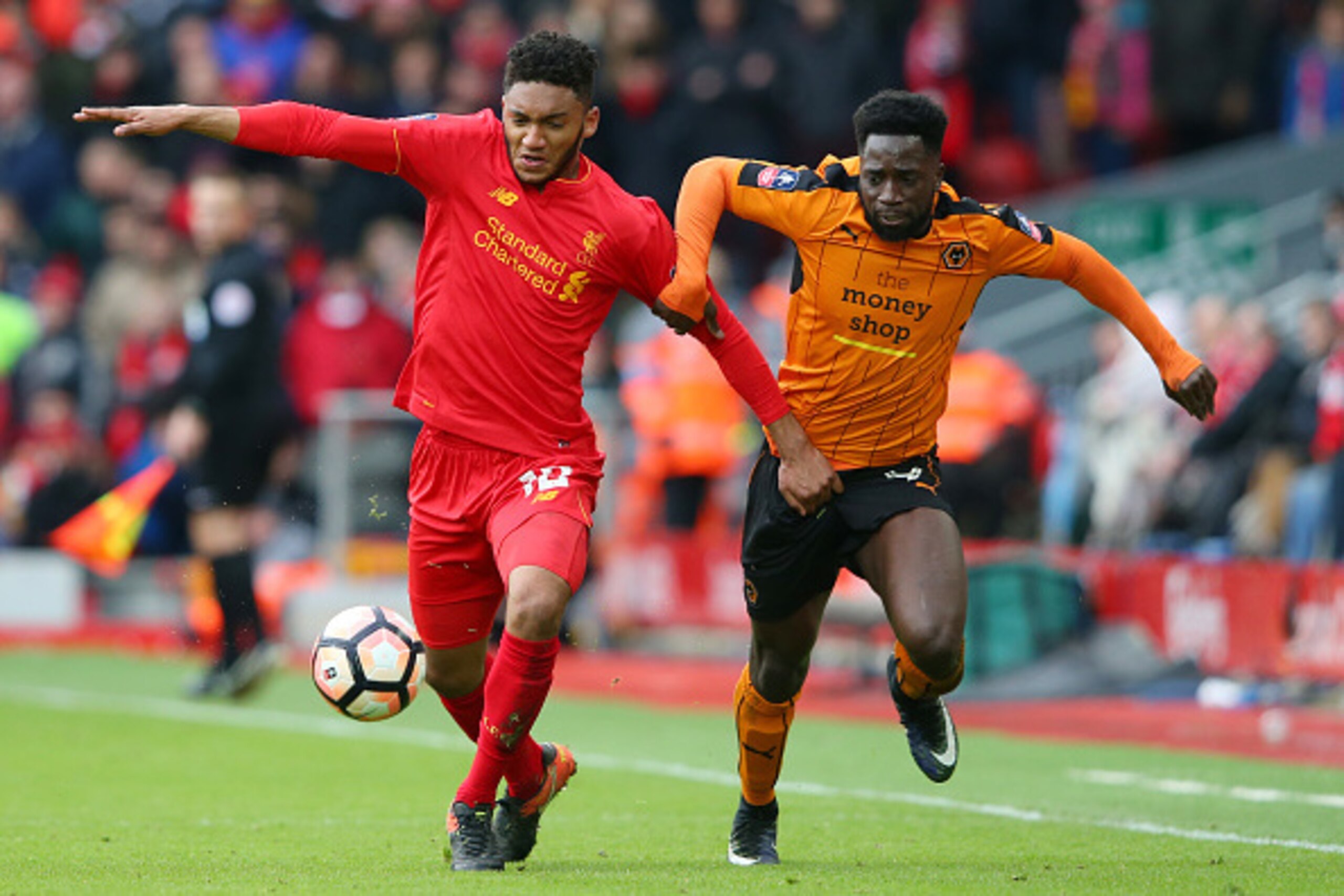 LIVERPOOL, ENGLAND - JANUARY 28:  Joe Gomez of Liverpool and Nouha Dicko of Wolverhampton Wanderers compete for the ball during the Emirates FA Cup Fourth Round match between Liverpool and Wolverhampton Wanderers at Anfield on January 28, 2017 in Liverpoo
