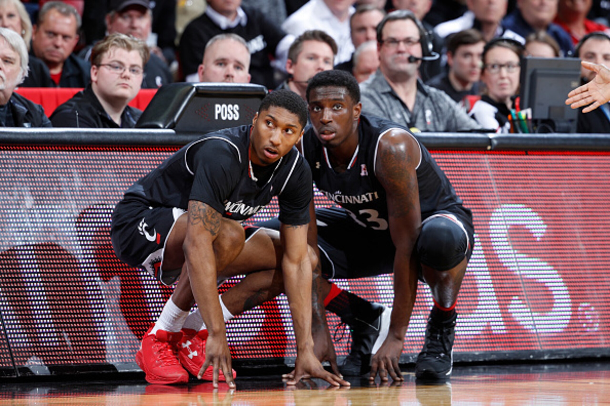 CINCINNATI, OH - JANUARY 26: Kevin Johnson #25 and Nysier Brooks #33 of the Cincinnati Bearcats wait to come into the game against the Xavier Musketeers at Fifth Third Arena on January 26, 2017 in Cincinnati, Ohio. Cincinnati defeated Xavier 86-78. (Photo