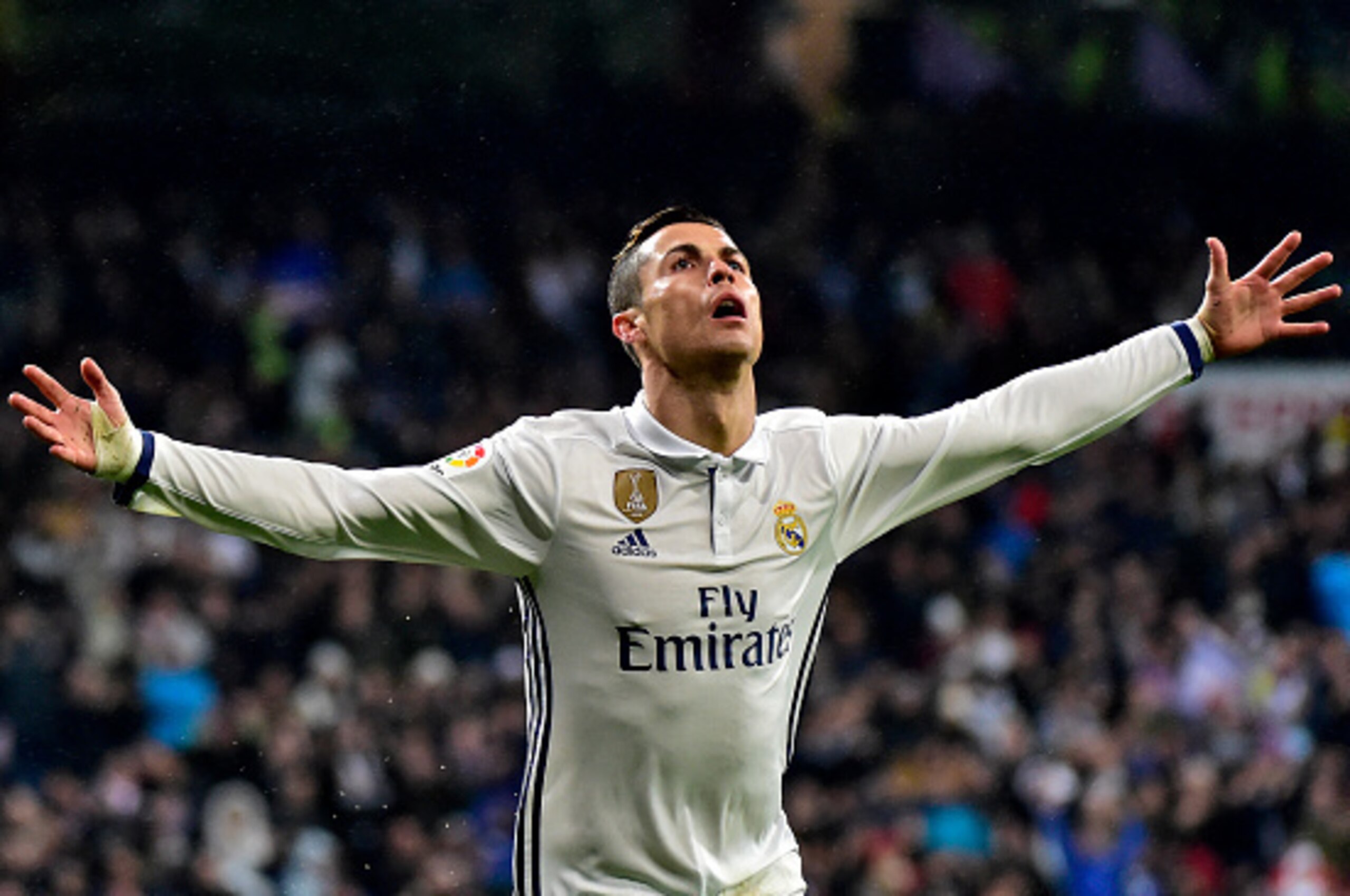 Real Madrid's Portuguese forward Cristiano Ronaldo celebrates after scoring a goal during the Spanish league football match Real Madrid CF vs Real Sociedad at the Santiago Bernabeu stadium in Madrid on January 29, 2017. / AFP / GERARD JULIEN        (Photo