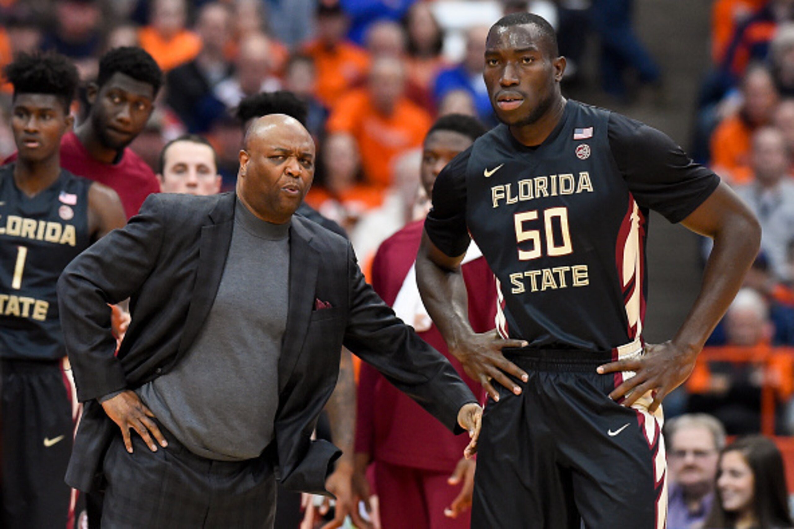 SYRACUSE, NY - JANUARY 28:  Head coach Leonard Hamilton of the Florida State Seminoles talks with Michael Ojo #50 against the Syracuse Orange during the first half at the Carrier Dome on January 28, 2017 in Syracuse, New York. Syracuse defeated Florida St