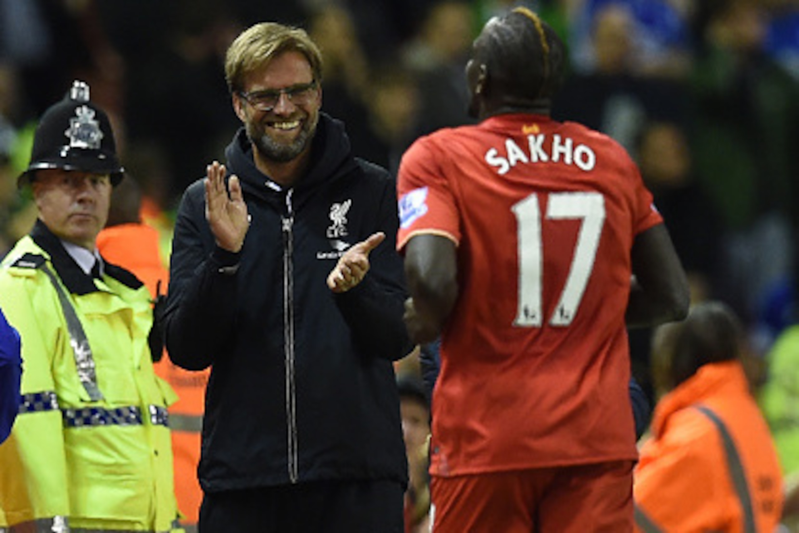 Liverpool's French defender Mamadou Sakho (R) celebrates with Liverpool's German manager Jurgen Klopp after scoring during the English Premier League football match between Liverpool and Everton at Anfield in Liverpool, north west England on April 20, 201