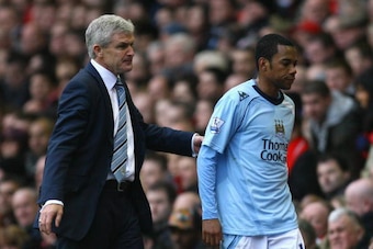 LIVERPOOL, UNITED KINGDOM - FEBRUARY 22:  Manchester City Manager Mark Hughes substitutes Robinho during the Barclays Premier League match between Liverpool and Manchester City at Anfield on February 22, 2009 in Liverpool, England.  (Photo by Alex Livesey